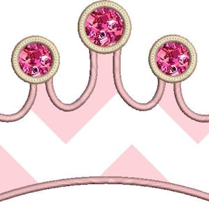 May include: A pink crown with five pink jewels, each with a gold rim. The crown has a pink and white chevron pattern.
