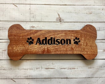 Small wooden dog bone shape sign with paw prints personalized with your pets name, Dog Paw Sign, approximately 10” x 4”