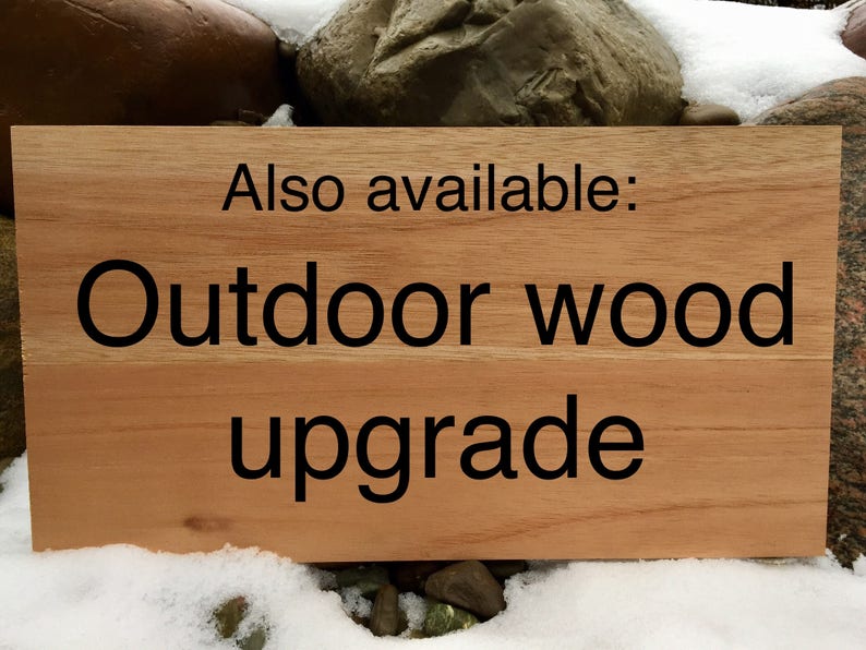 May include: A wooden sign with the text "Also available: Outdoor wood upgrade" on a brown background.