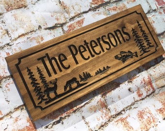 Wooden Carved Sign with Deer, Fish and Trees. Personalize the custom sign with Family Name or Address. Great Father's Day Gift