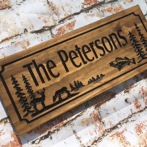 Wooden Carved Sign with Deer, Fish and Trees. Personalize the custom sign with Family Name or Address. Great Father's Day Gift