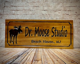 Wood sign with moose image and personalized with your custom text.