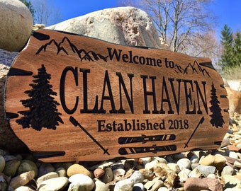 Custom Wood Sign for Winter Getaway ski chalet includes images of poles, pine tree and mountains