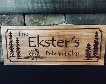 Wooden carved sign with campfire and pine trees. Father’s Day gift ideas