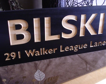 Outdoor wooden carved sign with large letters for best visibility, personalized with name and address, black sign with natural wood tone.