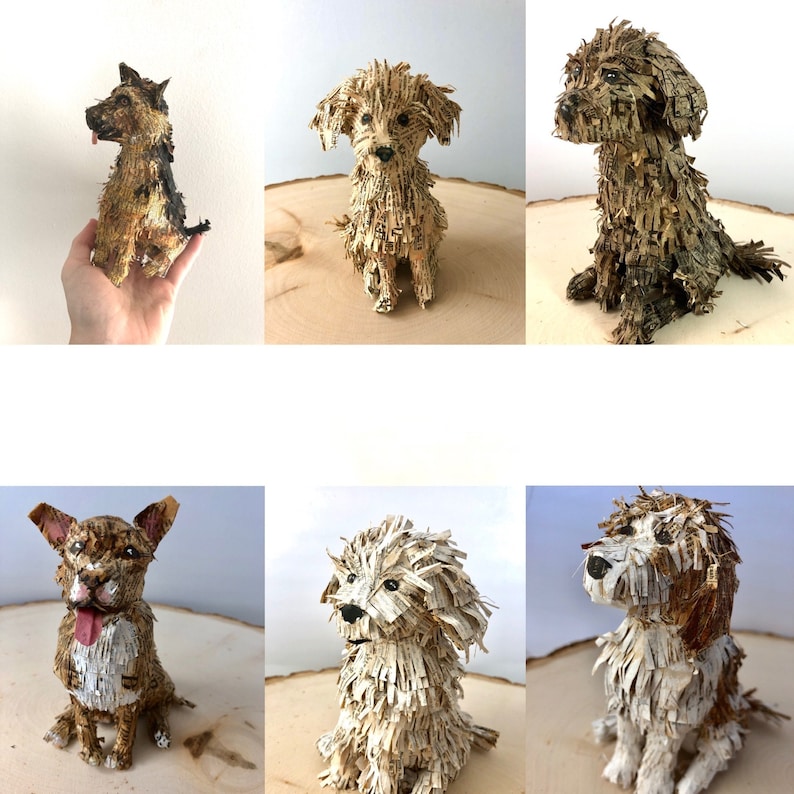 K&ouml;nnte beinhalten: Sechs Papiermach&eacute;-Hunde in verschiedenen Posen. Die Hunde sind aus Papier gefertigt und haben ein realistisches Aussehen. Die Hunde sind alle in verschiedenen Farben und haben unterschiedliche Fellmuster.