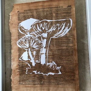 Paper cut art Mushroom. Silhouette art. Antique Book page, library decor