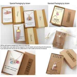 May include: A variety of packaging options for jewelry.  The boxes are brown cardboard with the company name "Azram" printed on them.  Some boxes include a small card with the text "Hand Made in the USA".  One box has a small white bag with a pearl necklace inside.  The text "Thanks for helping us tie the knot" is printed on some of the boxes.