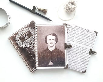 May include: A brown leather-bound journal with a gold spiral binding. The front cover features a white design of a tree with the words "Stories by Poe" in a white banner. The back cover features a black and white photo of Edgar Allan Poe. The text on the back cover reads "Death of Edgar A. Poe. He died in Baltimore the day before yesterday. This announcement will startle many, but few will be grieved by it. The poet was known, personally or by reputation, in all this country, ..."