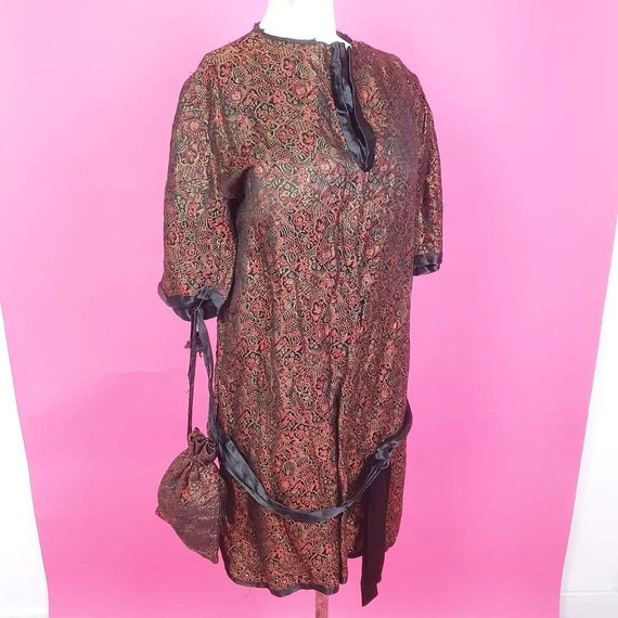 Beautiful 1920s lamé tunic top with attached hip b