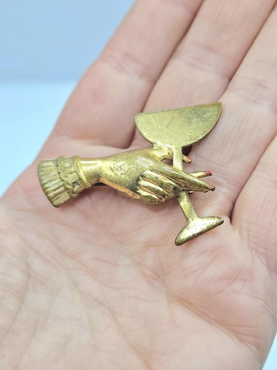 1930s 40s goldtone hand holding a glass metal brooch red nails kitsch rare perfect Christmas gift present
