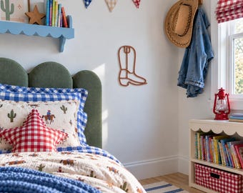 May include: A brown wire outline of a cowboy boot mounted on a white wall. The boot shape is simple and minimalist, featuring a classic silhouette with a defined heel, shaft, and toe. It is positioned centrally on the wall above a bed.