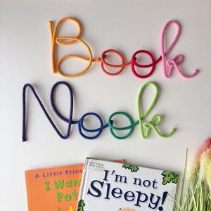 Colorful Book Nook sign decorating playroom reading nook