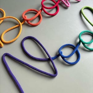 Colorful wall sign for book corner, rope and wire kids reading nook decoration.