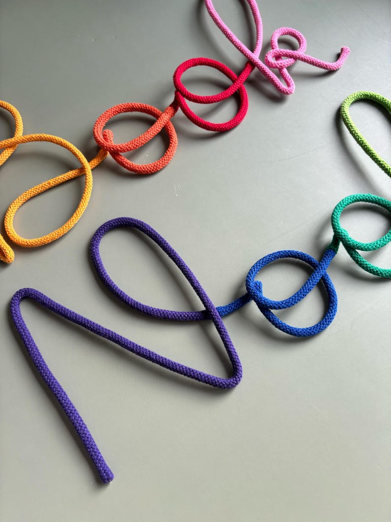 Colorful wall sign for book corner, rope and wire kids reading nook decoration.