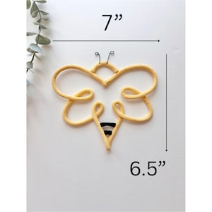 Bumblebee wall art made from cord in soft neutral colors