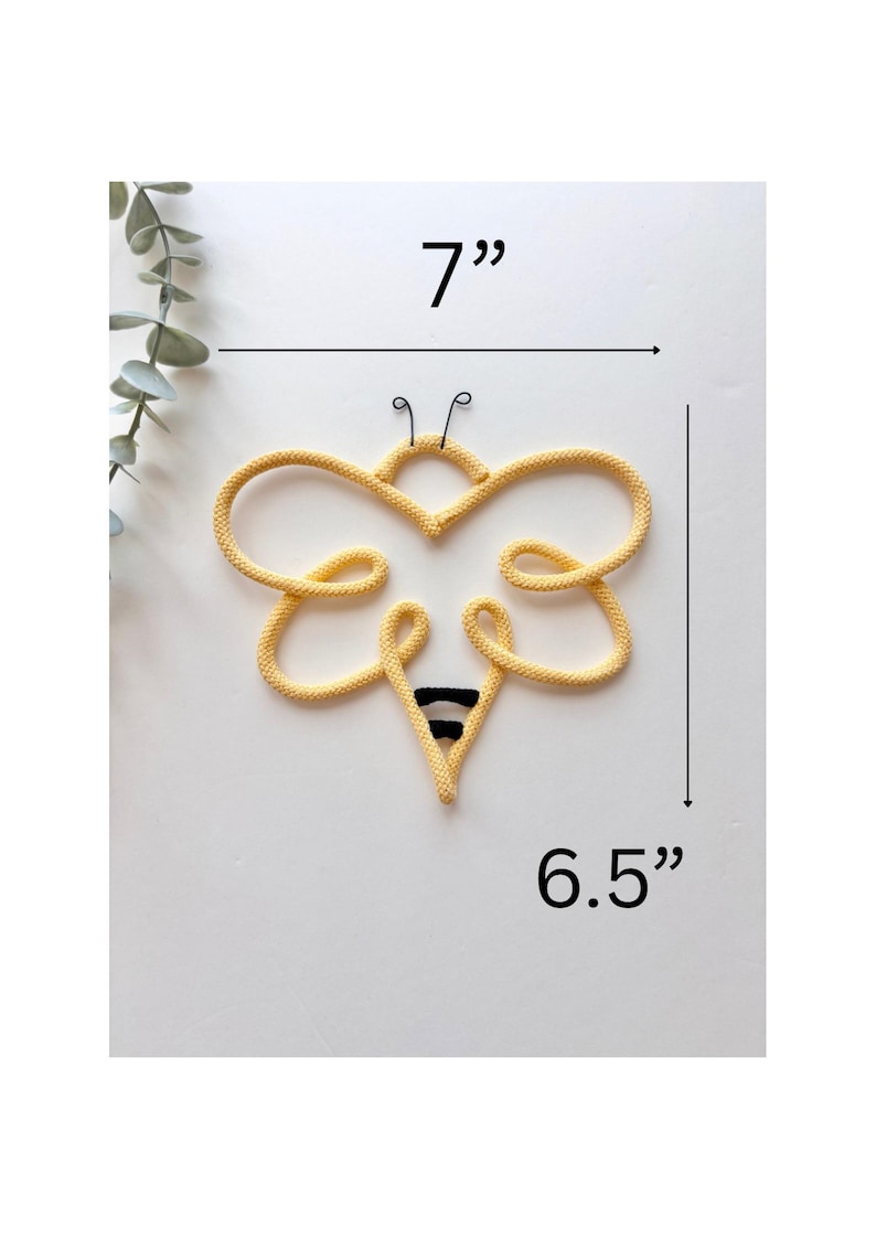 Bumblebee wall art made from cord in soft neutral colors