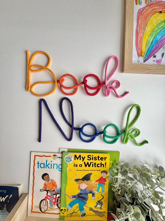 Multicolored book nook sign for reading corner decor