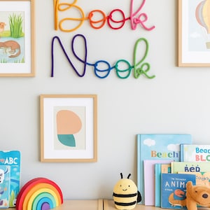 Playroom reading corner rainbow Book Nook sign gift idea for book-loving kids.