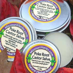 May include: Two silver tins of Poke Root Castor Salve, a natural herbal remedy. The labels are yellow with black text and feature a green leaf design. The text on the label reads "Missouri Herbs.com Poke Root Castor Salve Natural Herbal Relief". The tins are 1 oz and 2 oz.