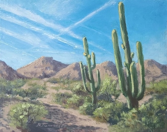 May include: Oil painting of a desert landscape with tall saguaro cacti under a bright blue sky with contrails. The foreground features desert vegetation and a dirt path, with brown mountains in the background.