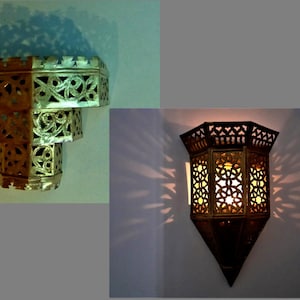 Moroccan brass lamps
1 Pair conical lamps of four geometric panels ending in pointed base and fluted top
 28cm x18cm
2 Pair stepped lamps in 3 tiers, widest at the top. Pierced with swirly pattern and castellated borders   
28cm x18cm