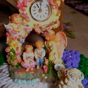 Heavenly Angel Pendulant Clock, Working or Dreamsicles Cherub Holding a Bird in His Hands