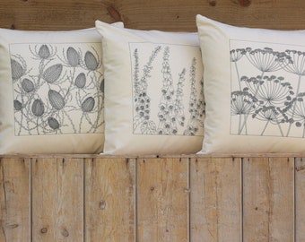 A set of three cushion covers