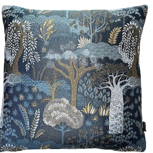 May include: A blue and gold throw pillow with a woven pattern of trees and leaves.