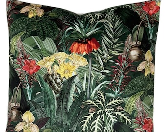 May include: A green throw pillow with a tropical print featuring red, yellow, and white flowers, green leaves, and a brown textured stem.
