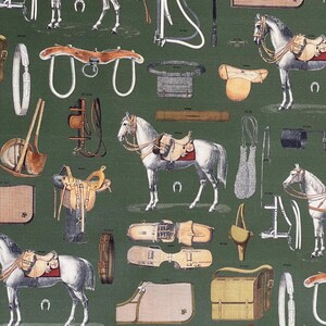 May include: A green and white patterned fabric with illustrations of horse riding equipment, including saddles, bridles, stirrups, and horses. The fabric features a variety of colors, including brown, black, white, and red.