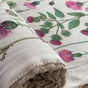 Wildflower linen-look fabric roll featuring pink thistles and green foliage, ideal for curtains, blinds, or soft furnishings – detailed view