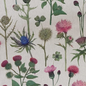 Detailed view of wildflower print fabric with Scottish thistles and clovers in soft countryside tones – ideal for curtains and soft furnishings