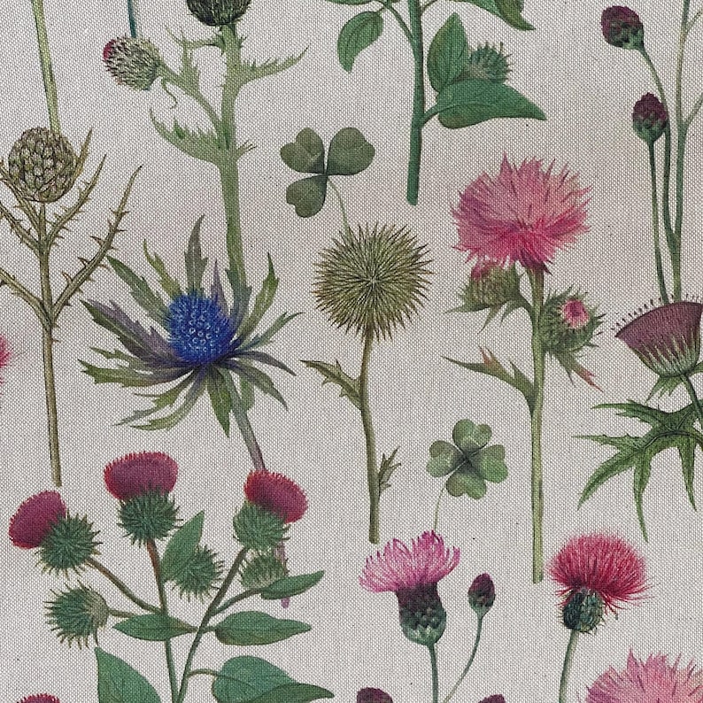 Detailed view of wildflower print fabric with Scottish thistles and clovers in soft countryside tones – ideal for curtains and soft furnishings