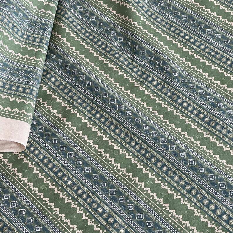 Textured sage green cotton fabric with tribal-style lines and diamonds – ideal for eco-conscious home decor, drapes, cushions, or boho-inspired sewing