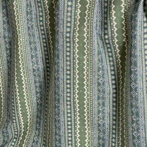 Folk-style cotton fabric with sage green and denim blue stripes, shown with scale – perfect for boho curtains, cushion covers, and handmade home projects