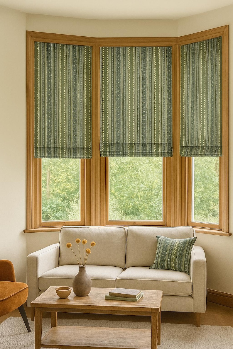 Custom Roman blinds and accent cushion in sage green stripe fabric with ethnic-inspired motifs – handmade window coverings for cozy, earthy interiors