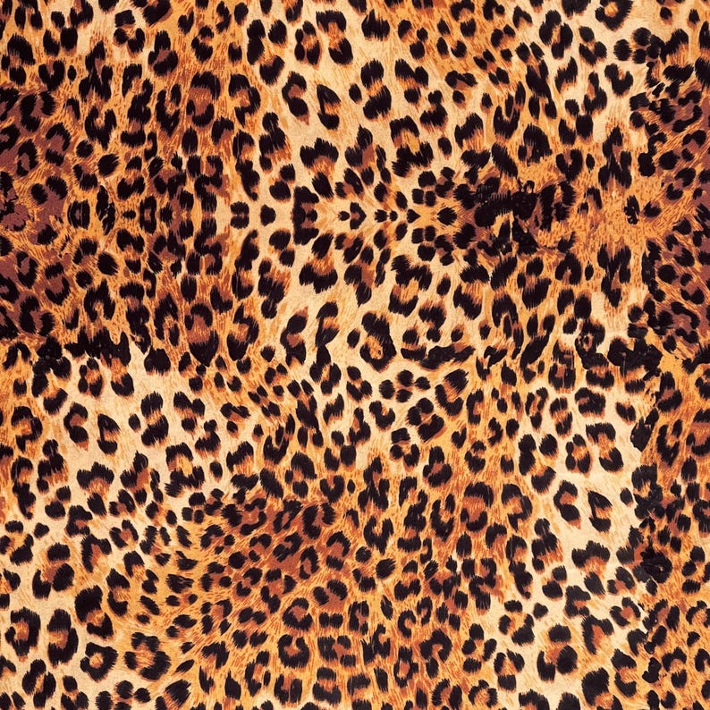 Animal print velvet furnishing fabric featuring realistic leopard pattern for home decor and upholstery projects.