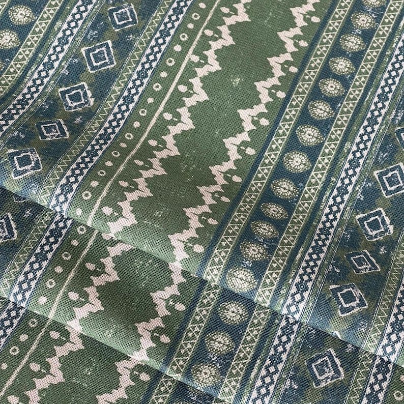 Rustic sage green and blue cotton fabric with tribal-inspired stripe and diamond motifs – perfect for farmhouse curtains, cushions, or boho upholstery projects