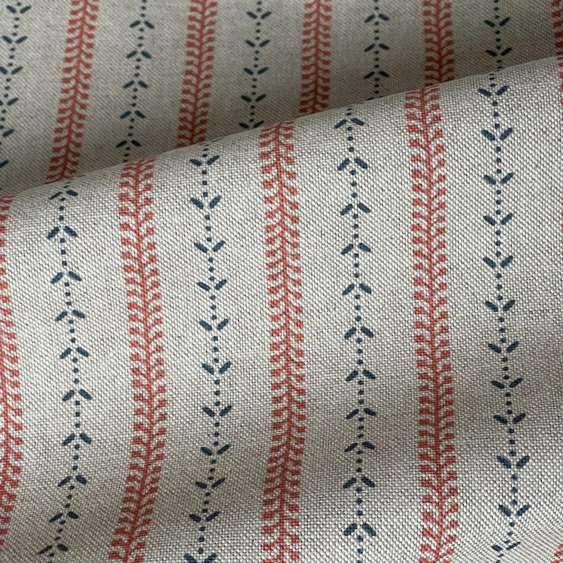 The fabric features alternating vine sprigs between faded terracotta stripes, creating a classic country stripe.