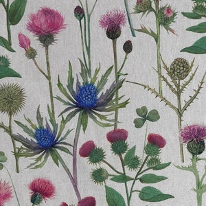 Scottish thistle floral print fabric in pink and blue on natural linen look background – perfect for country cottage curtains and soft furnishings