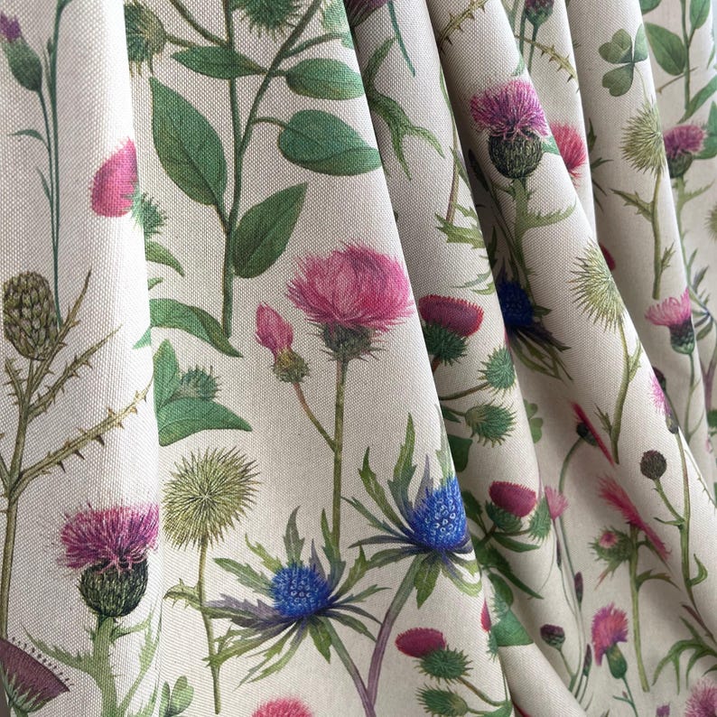 Draped wildflower fabric featuring Scottish thistles and eryngium in soft country tones – perfect for cottagecore curtains, cushions, and decor.