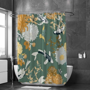 May include: A green shower curtain with a floral and fish pattern. The flowers are white, yellow, and orange. The fish are black, white, and gray.