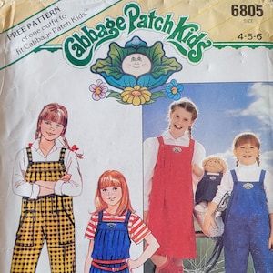 May include: Vintage Butterick sewing pattern 6805 for children's clothing. The pattern features illustrations of girls in overalls, jumpers, and shorts. The cover includes the text "Cabbage Patch Kids" and "Bonus! Iron-on Transfers Included."