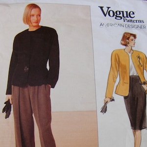 May include: Vogue Patterns sewing pattern featuring designs by Anne Klein. The pattern includes illustrations of a woman wearing a black jacket and brown pants, and a yellow jacket and skirt. The text "ANNE KLEIN" is printed at the bottom.