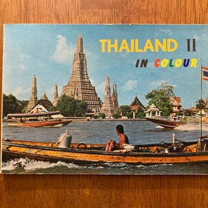 1958 full-color travel guide to Thailand celebrates the nation&#39;s &quot;exotic&quot; traditions and beauties, including dancing women and silky beaches