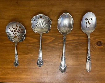Antique serving spoons made in the 1880s to the 1940s: intricate Victorian bonbonnerie spoons, pierced serving spoon, round serving spoon