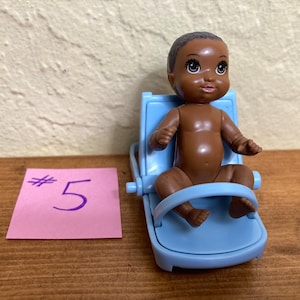 Cherubic baby dolls including Mattel Heart Family babies, a Kid Kore baby, and Fisher Price Loving family babies, all  needing a new home