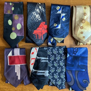 Vintage silk ties with musical motifs (mostly black but also midnight blue and gold), Art Deco furbelows, tasty snacks, and dainty flowers