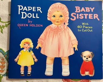 1985 Queen Holden's "Paper Doll and Baby Sister" " paper doll book gives new life to one of the most popular 1930s franchises